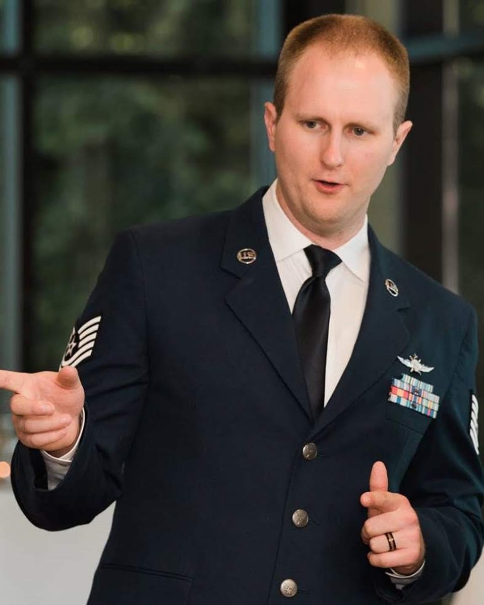 Justin Bowen speaking in US Air Force service dress